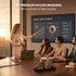 Person presenting in a meeting room with a large screen displaying a global market overview.