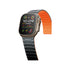Smartwatch with a black band and orange strap on a white background