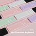 Collection of slim chocolate keyboards in various pastel colors on a pink background.