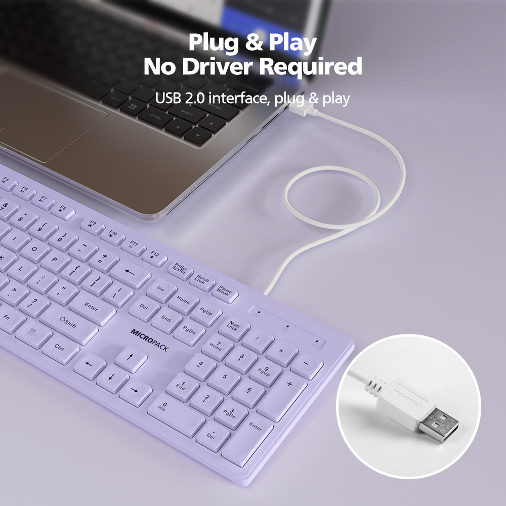 Keyboard with USB cable connected to a laptop on a light gray background