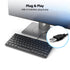 Keyboard with USB cable plugged into a monitor, emphasizing 'Plug & Play' feature.