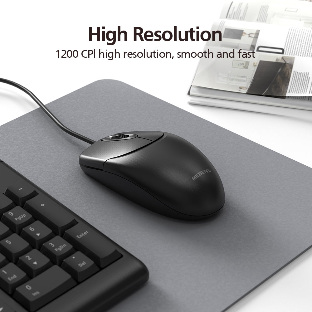 Black computer mouse on a gray mouse pad with keyboard and newspaper in the background, featuring text about high resolution.