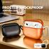 Frosted shockproof airpod cases by Micropack on a desk with laptop and radio.