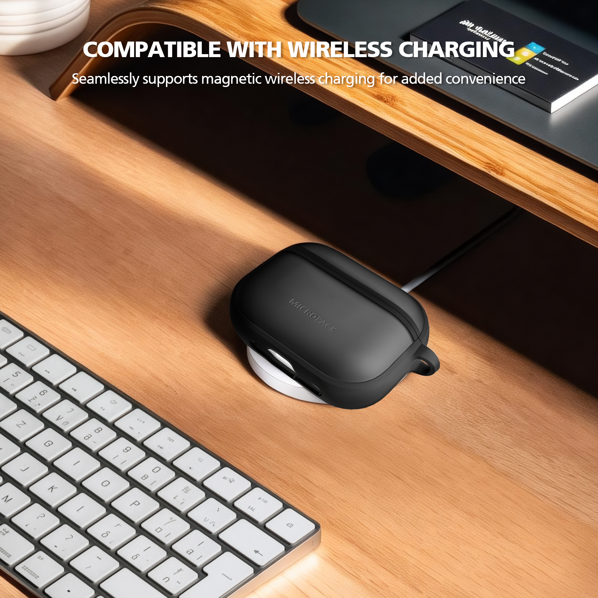 Black wireless charging case on a wooden desk with text about wireless charging compatibility.