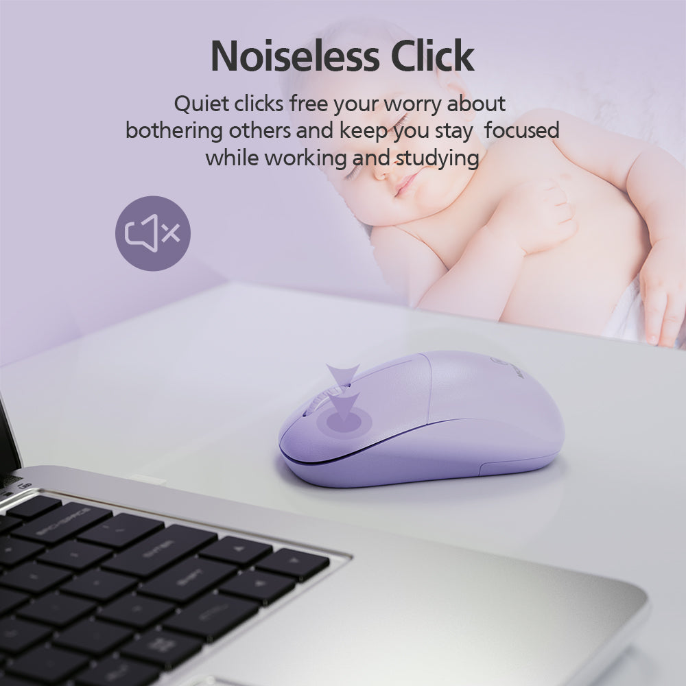 A lavender wireless computer mouse on a white desk next to a laptop, with promotional text reading 'Noiseless Click' and a sleeping baby in the background.