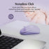 A lavender wireless computer mouse on a white desk next to a laptop, with promotional text reading 'Noiseless Click' and a sleeping baby in the background.