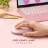 Hand using a pink computer mouse with a laptop and stationery on a pink surface
