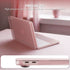 A translucent pink protective laptop case fitted over a silver laptop, shown on a soft pink tabletop with overlaid text reading 'PRECISE FIT' and a close-up of the side port cutout at the bottom. No person or animal is present, and the setting functions as a styled product presentation rather than a real lifestyle scene, so subject_type is Product/Packaging.