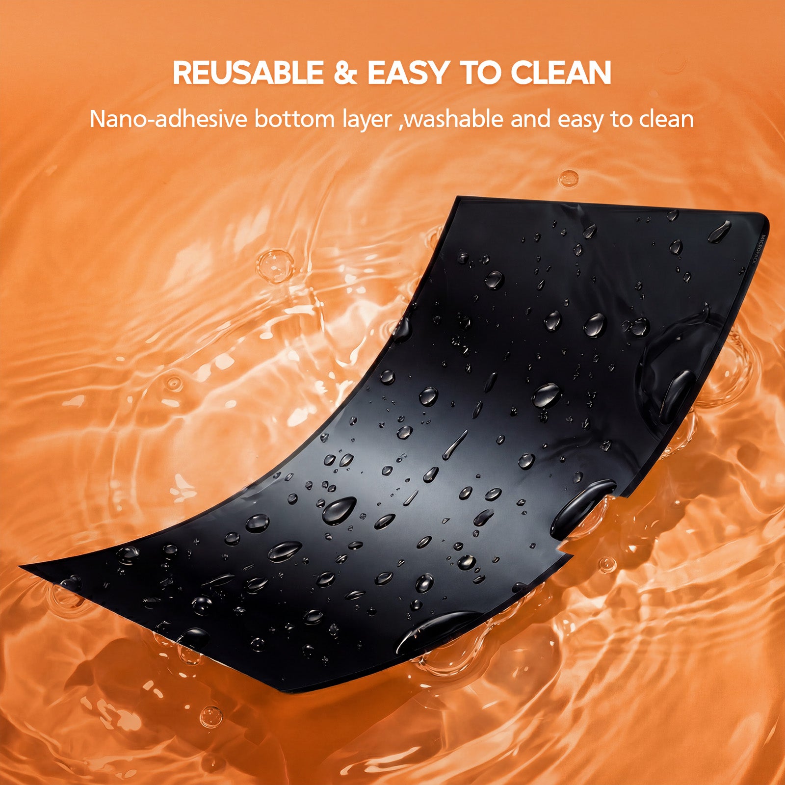 Black reusable mat with water droplets on an orange background, text indicating reusability and ease of cleaning.