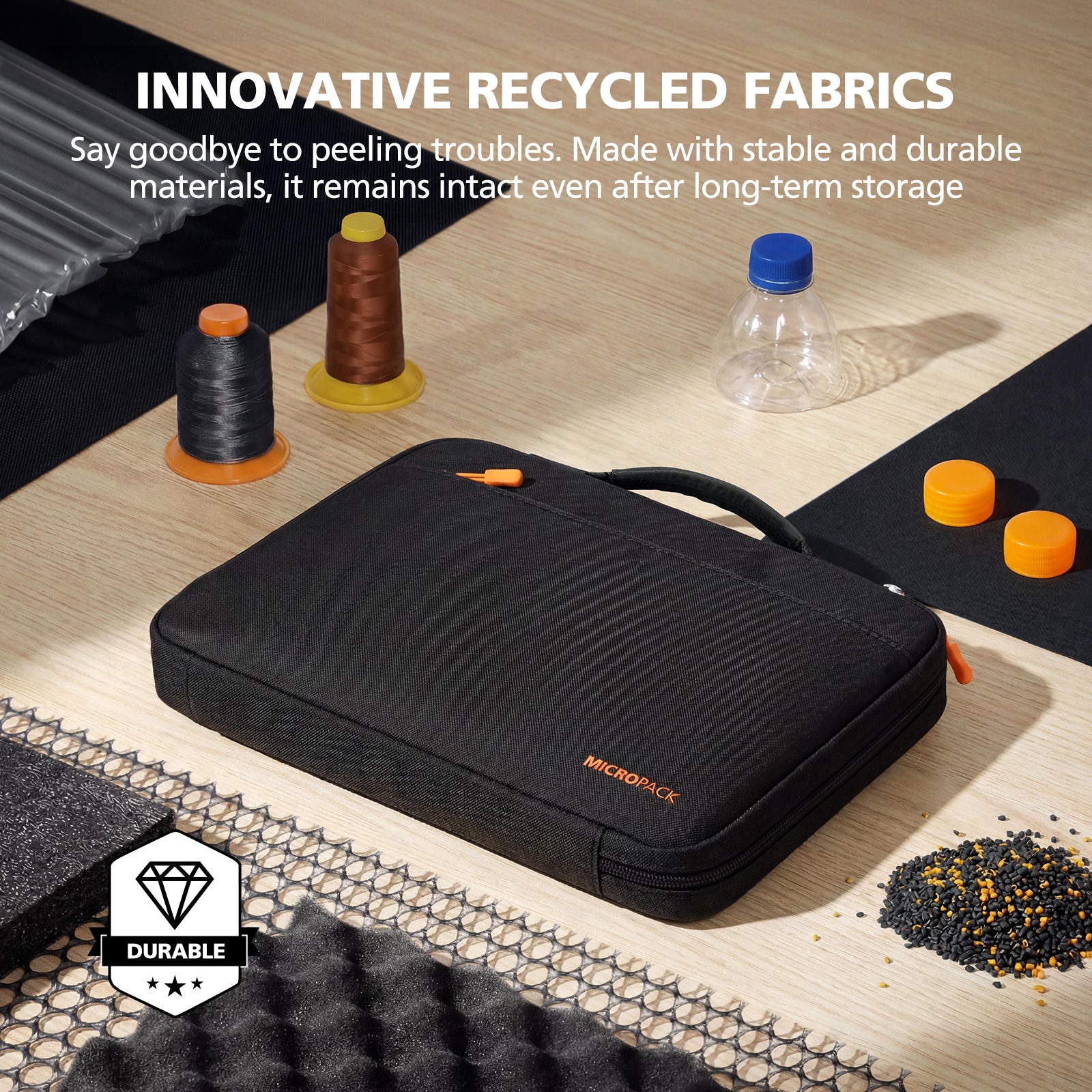 Black carrying case with recycled fabric on a wooden surface with sewing materials.