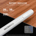 A white cylindrical battery indicator device labeled 'MICROPACK' placed diagonally on a black and wood background, with marketing text above reading 'BATTERY INDICATOR' and usage time claims. A small legend in the lower right shows battery percentage indicators.
