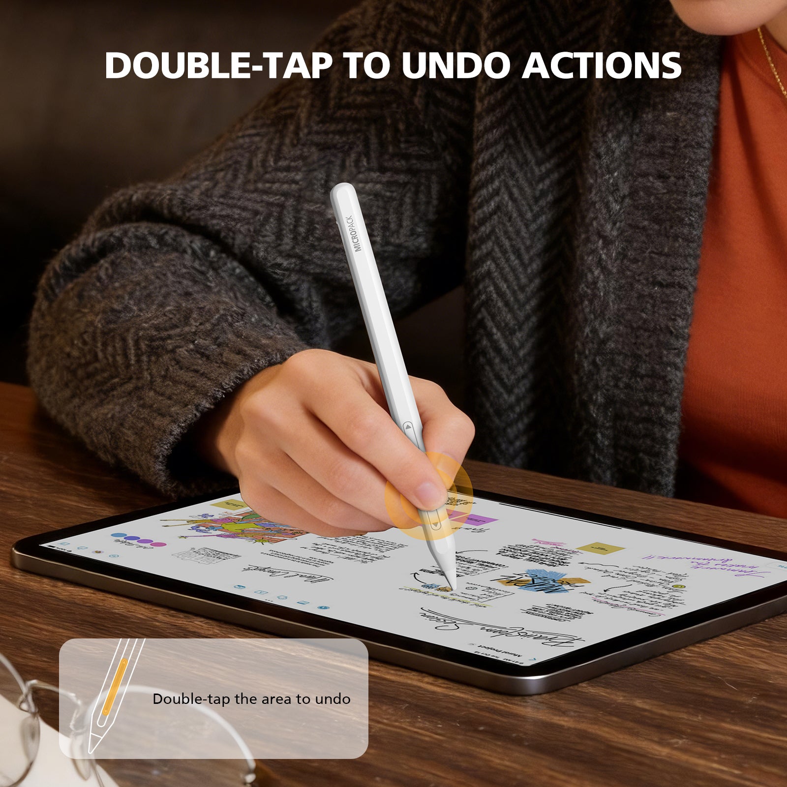 Person using a stylus on a tablet with text 'Double-tap to undo actions' displayed.