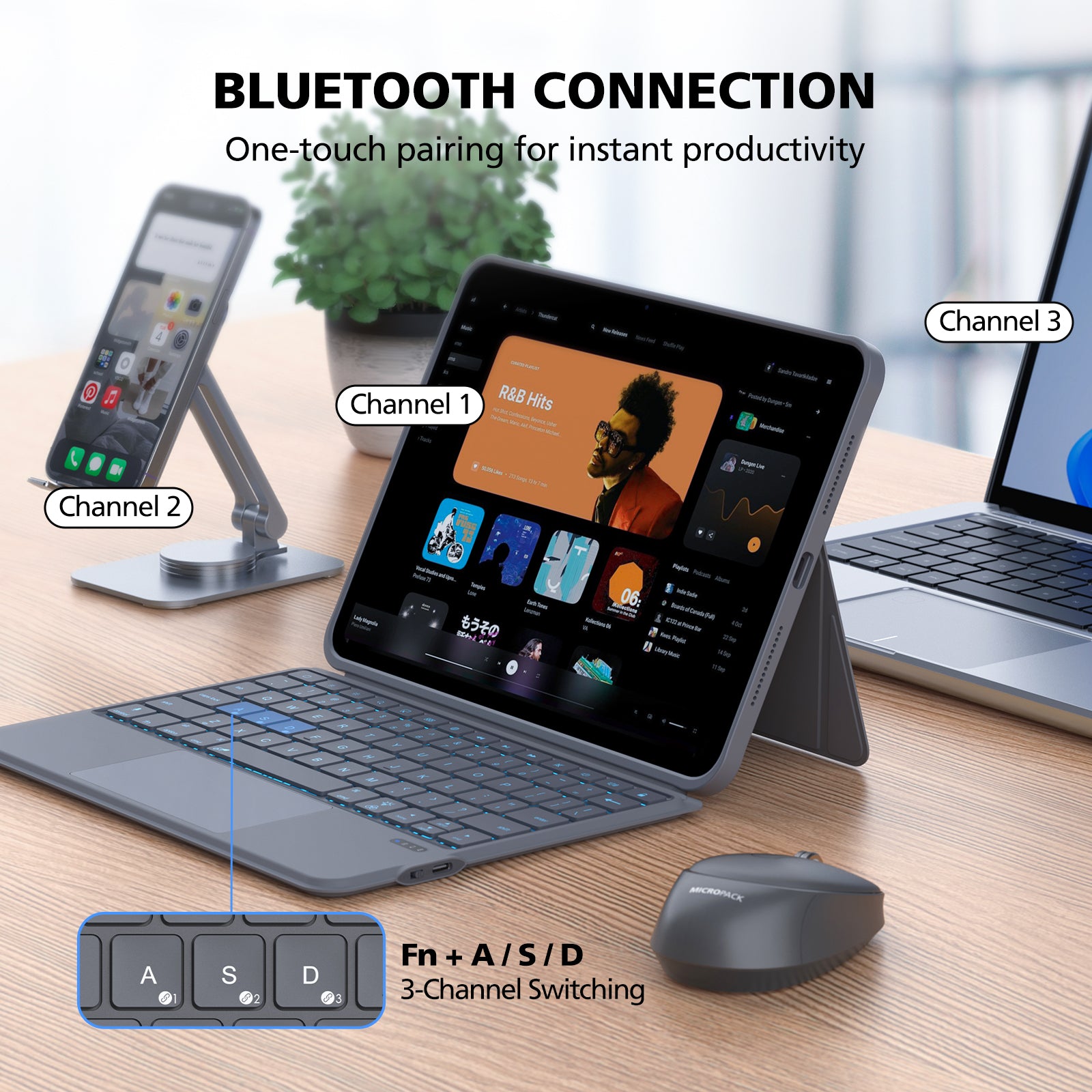 Tablet with keyboard and mouse on a desk, featuring Bluetooth connection text.