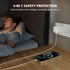 A man sleeping in bed at night while a smartphone receives wireless charging on a wooden bedside table. A white multi-port power adapter is plugged into a wall outlet nearby.