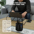 A black MICROPACK dual-device charger sits on a wooden table in a living room setting, with a man sitting on a gray sofa in the background charging a tablet and a smartphone. White text at the top reads 'CHARGE TWO DEVICES AT THE SAME TIME', and a diagram on the bottom left shows USB-C 20W, USB-A 18W, and total output 15W.